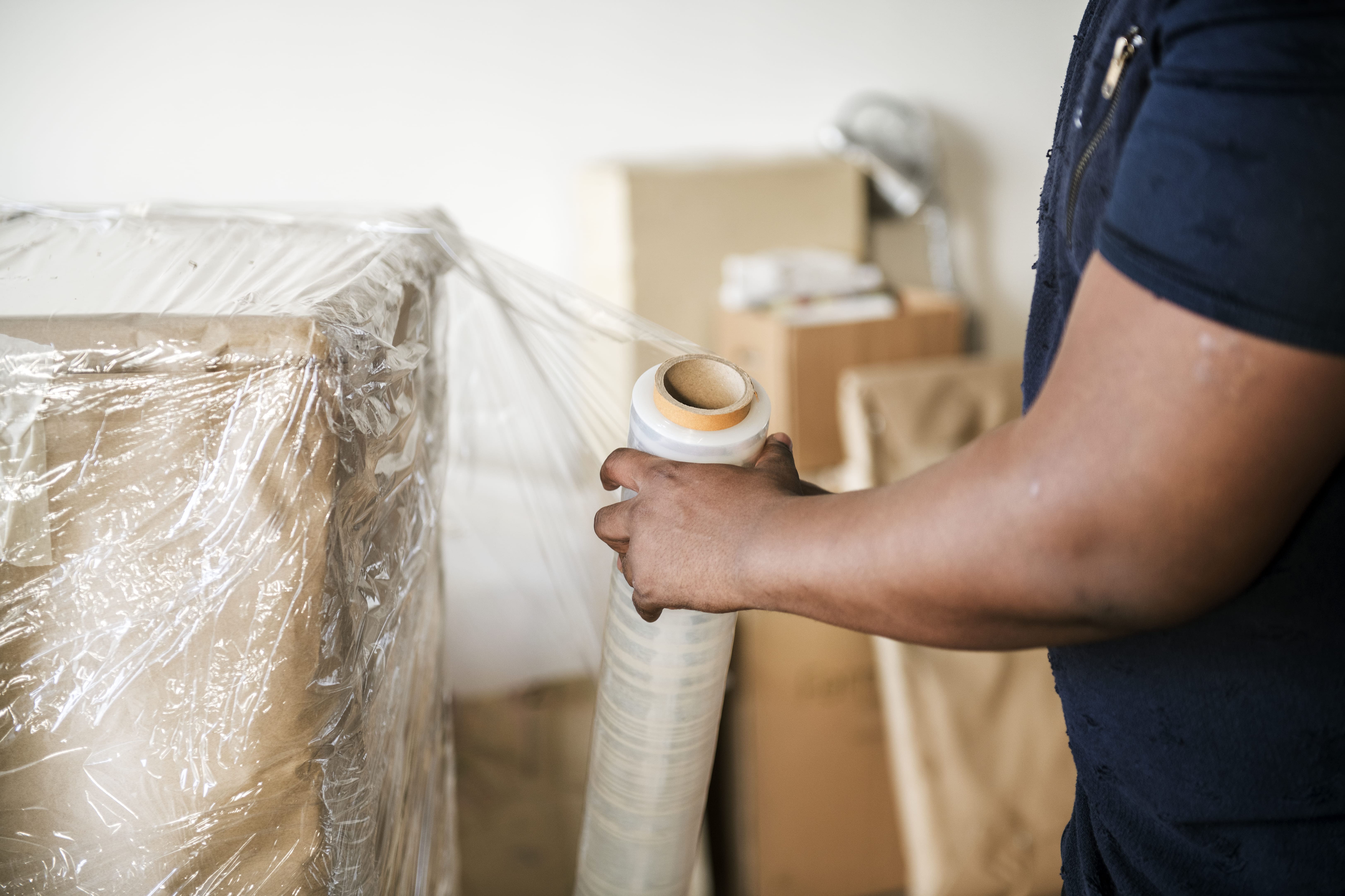 man packing boxes for moving